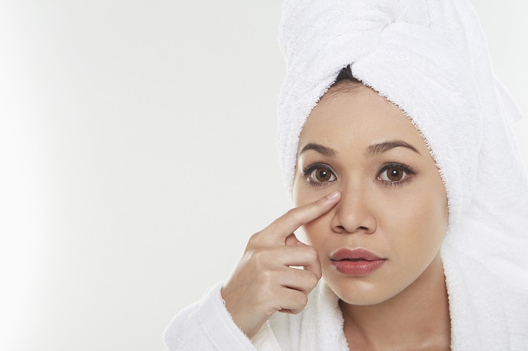 Woman touching her face
